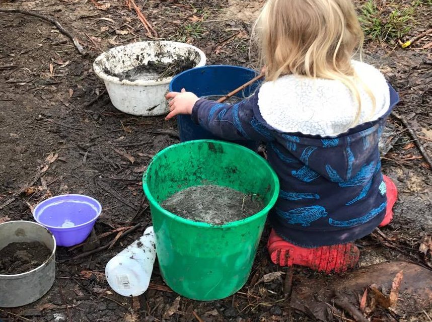 Child plays in mud