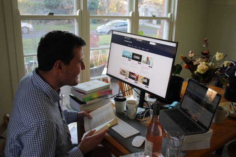 Man at computer learning online