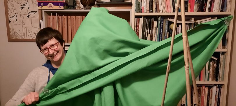 Penny Grist holding green fabric