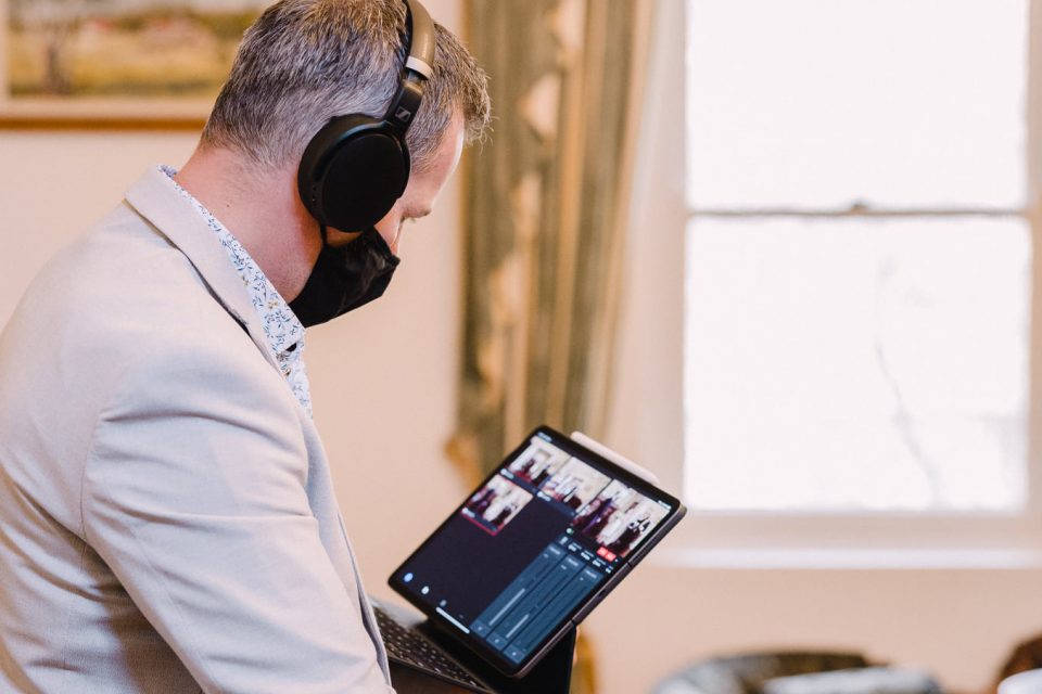 Wedding photographer Michael Conlin checking a livestream camera