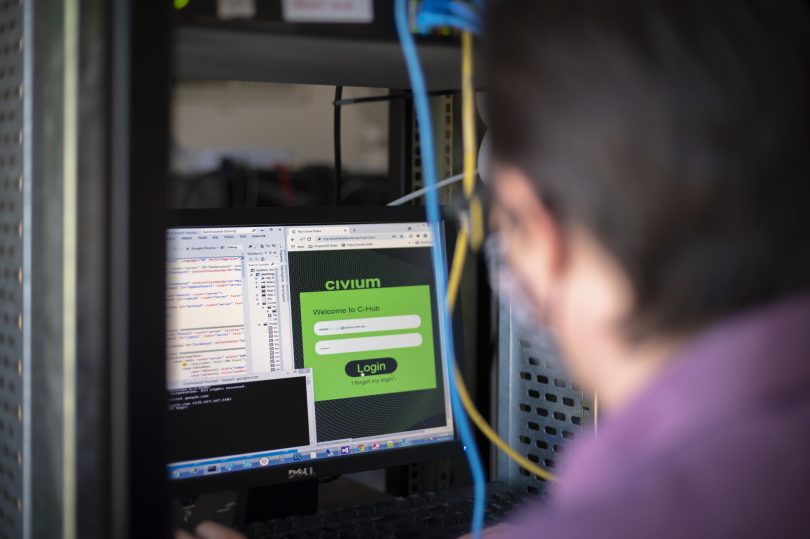 Worker looking at computer screen at Civium Property Group