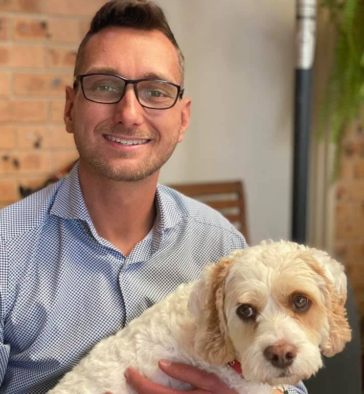 Man in glasses with dog