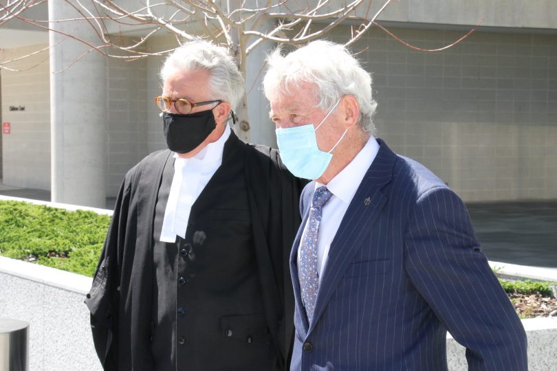 Two men leaving court