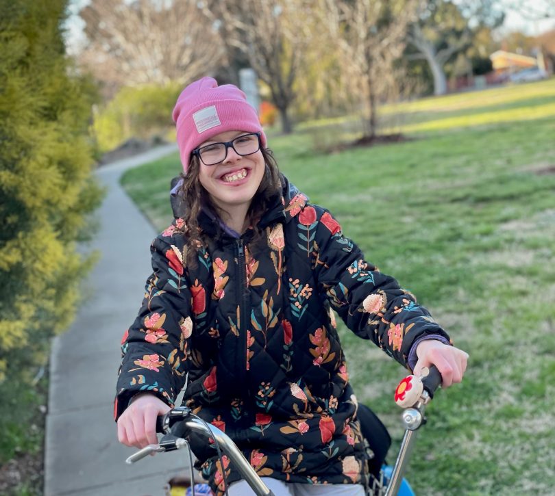 Mikayla Paine on tricycle