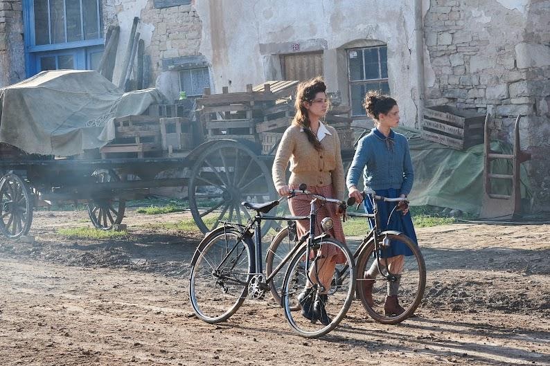 Two women with bikes in a scene from The Fantastic Journey of Margot and Marguerite