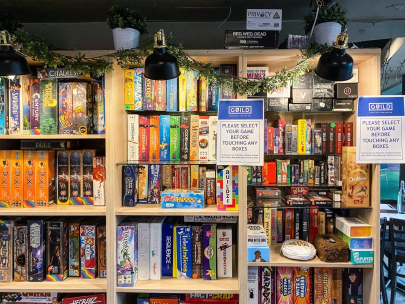 Shelf of board games at Guild