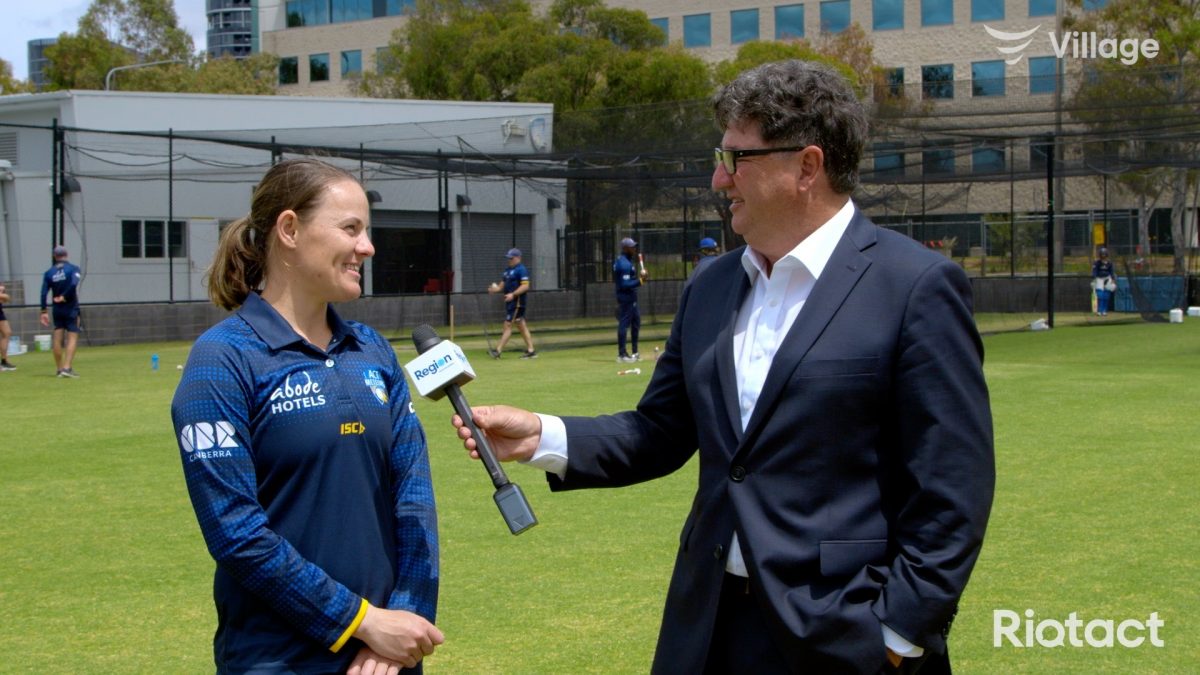 man and woman conducting interview on oval