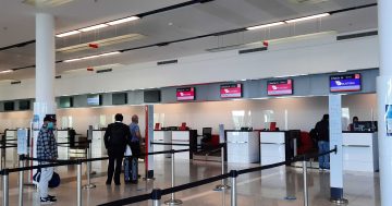 Isolating staff and Easter travellers put pressure on Canberra Airport
