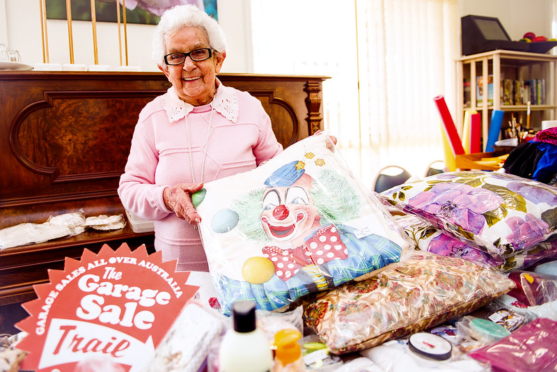 lady behind a garage sale 