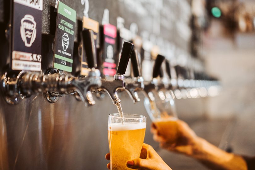 Beer being poured from taps