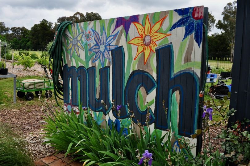 Colourful mural that says mulch in block letters