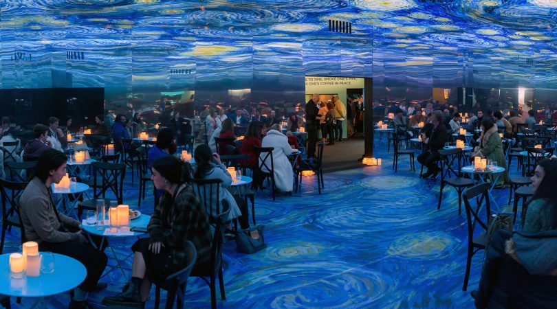 People sitting in the cafe part of Van Gogh Alive