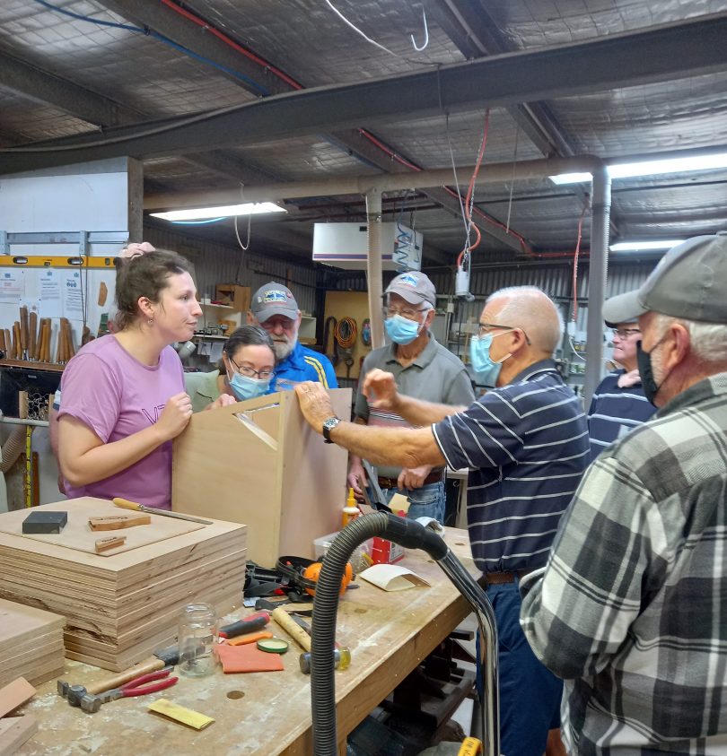 Jenna Ridley and Men's Shed members