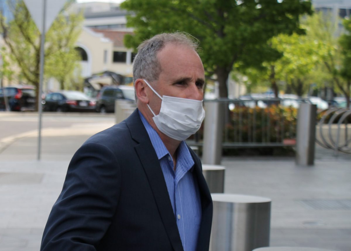 Stephen James Porter wearing mask walking to court