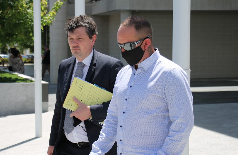 Two men leaving court