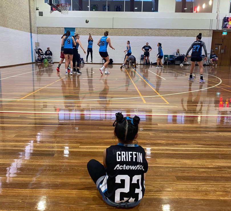 Five-year-old Maia Paku watching the University of Canberra Capitals train