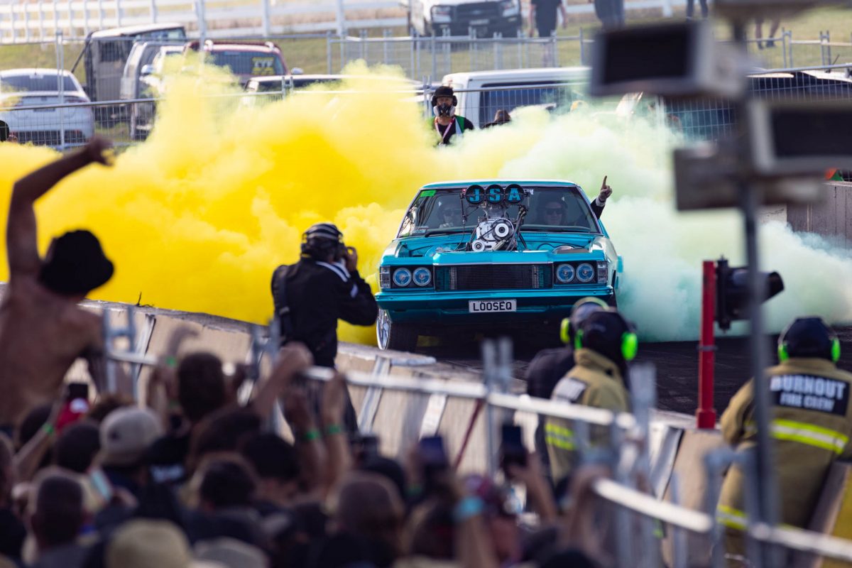 crowd cheering at car burnout