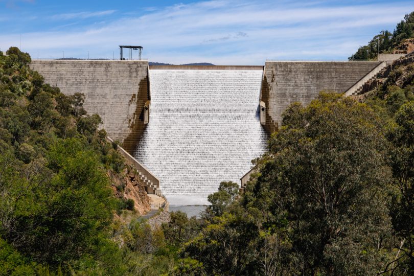 Water flowing over dam