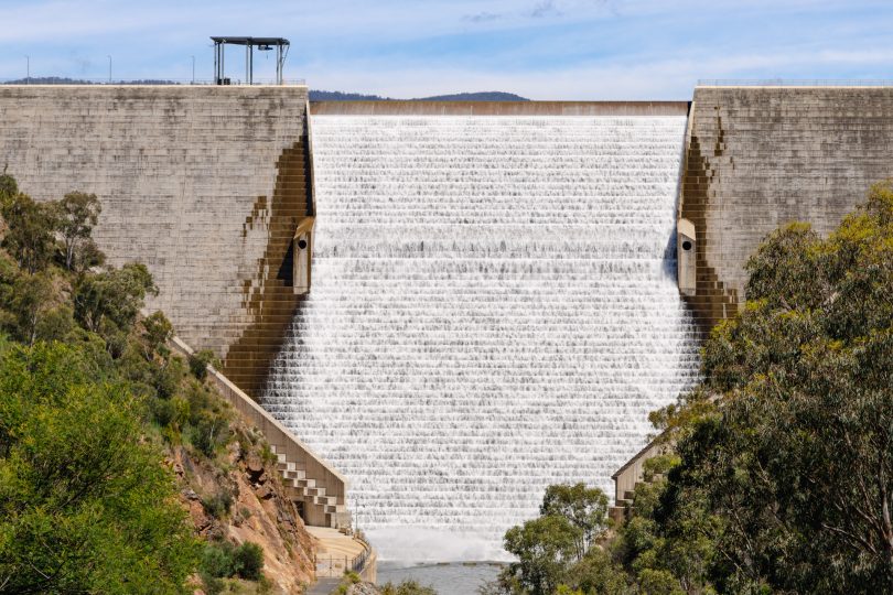 Water flowing over dam