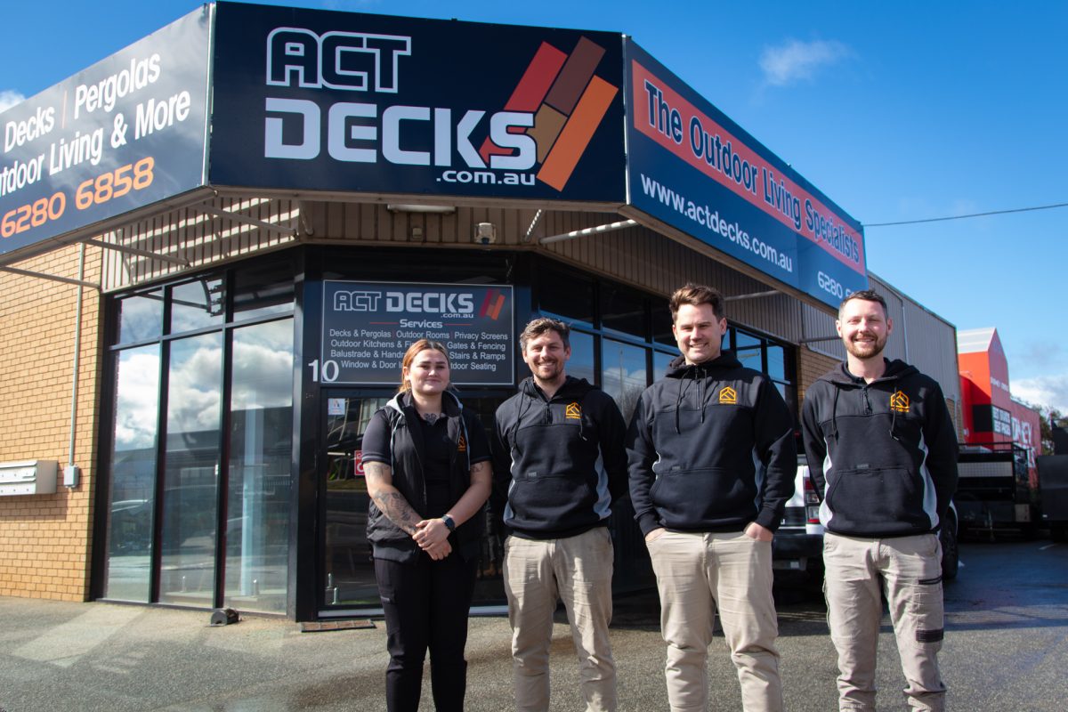 ACT Decks team standing in front of their office 