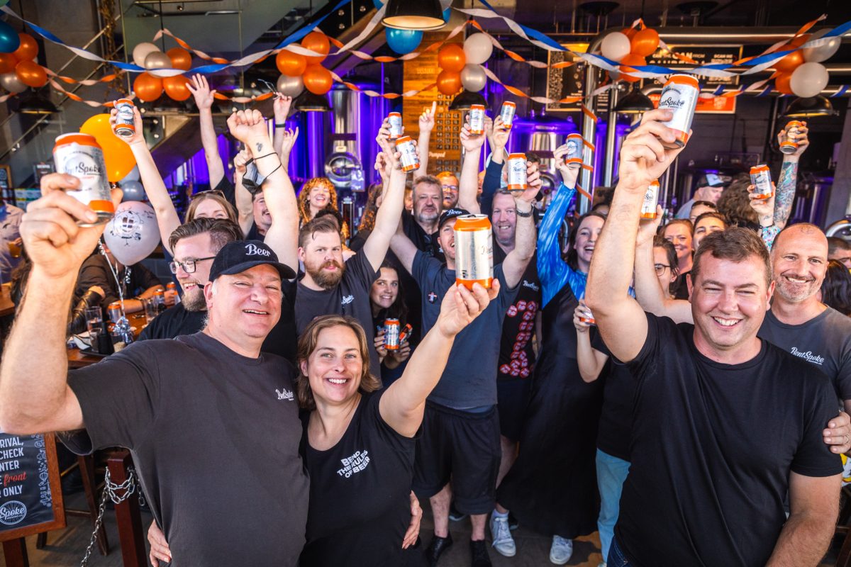 group of people holding beer