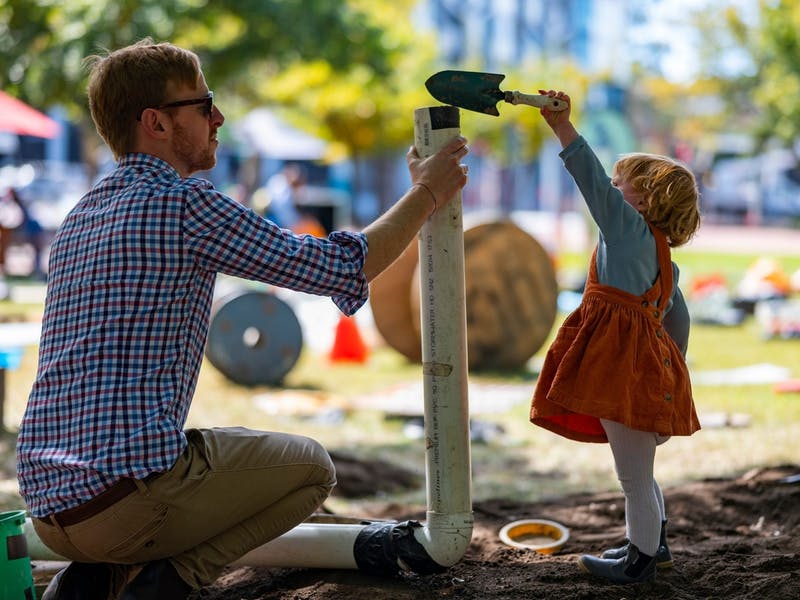 Child and adult playing outside