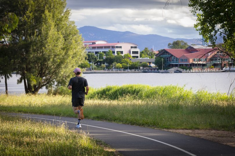 Man jogging near lake