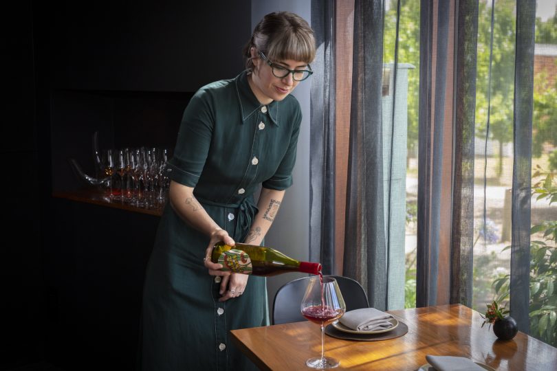 woman pouring wine