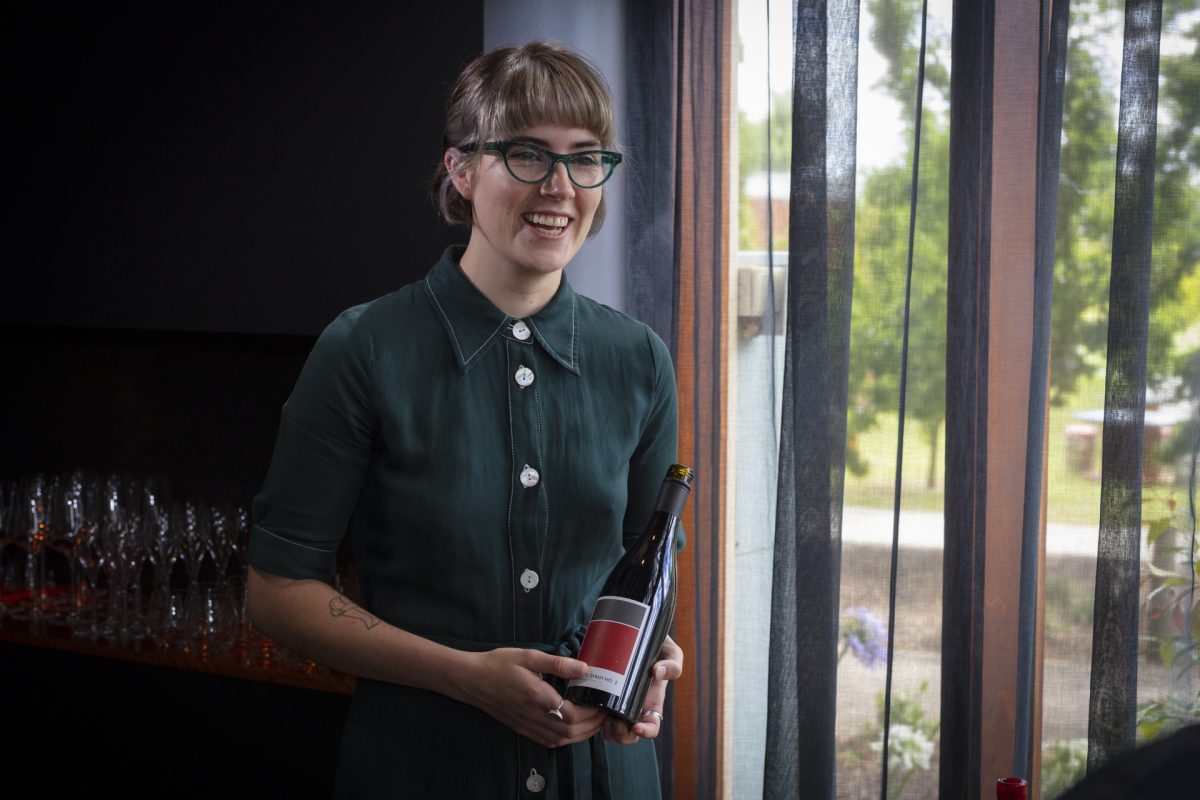 Woman holding wine bottle