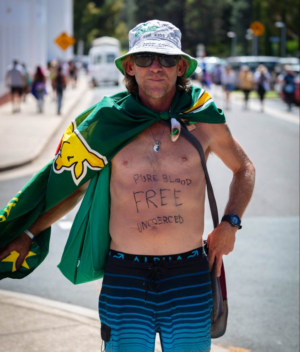 Man with bare chest and flag