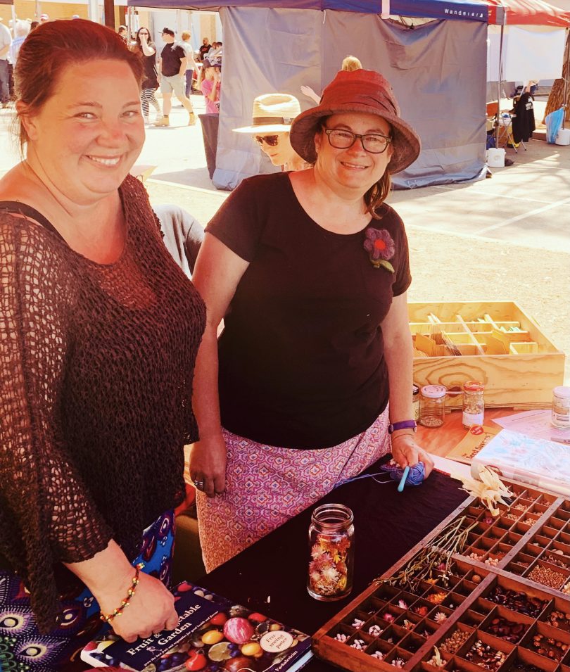 two women with seed tray