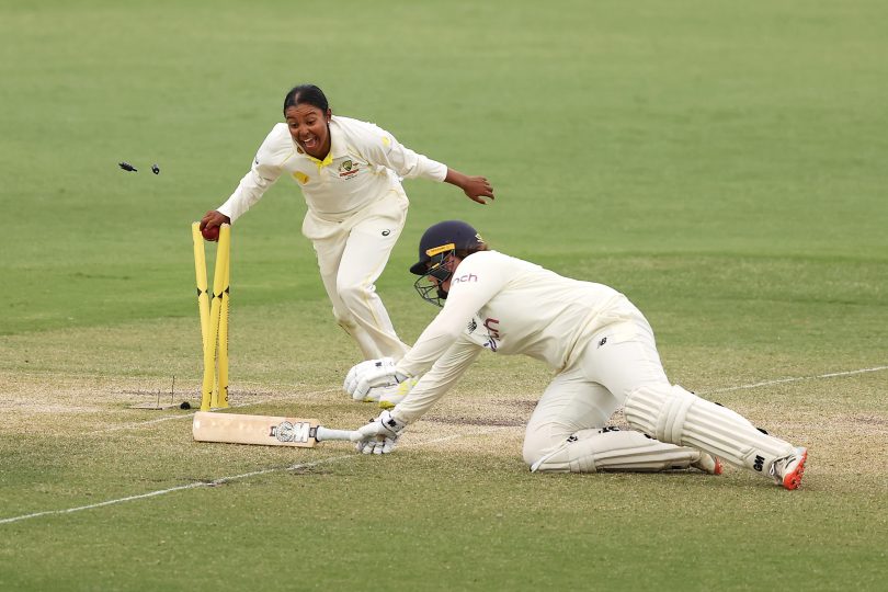 Alana King of Australia runs out Anya Shrubsole of England during day four of the Women's Test match in the Ashes series between Australia and England at Manuka Oval. Photo: Mark Kolbe/Getty Images with permission from Cricket ACT.