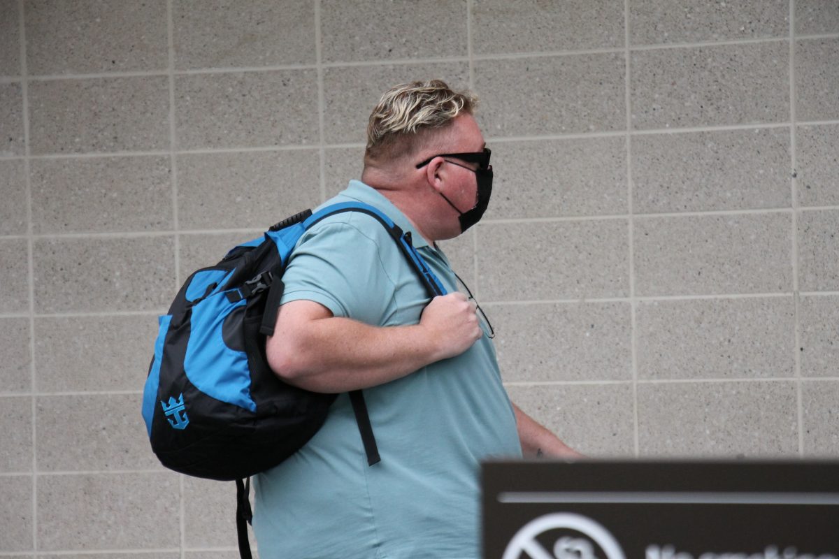 Obese man wearing a mask