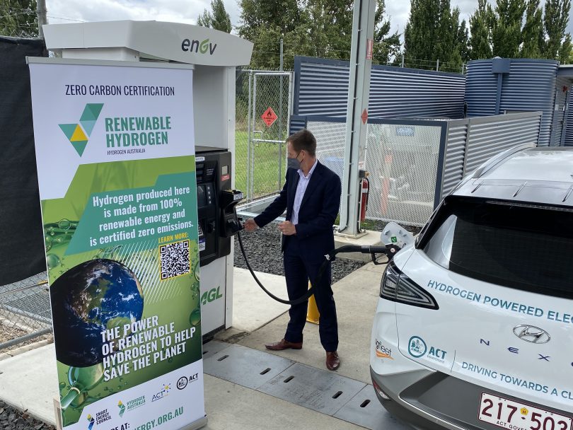 Shane Rattenbury recharging his vehicle with a hydrogen charger