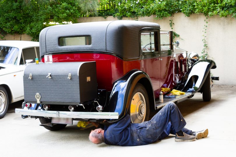 Man fixing car