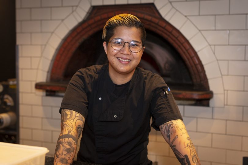 Chef with tattooed arms