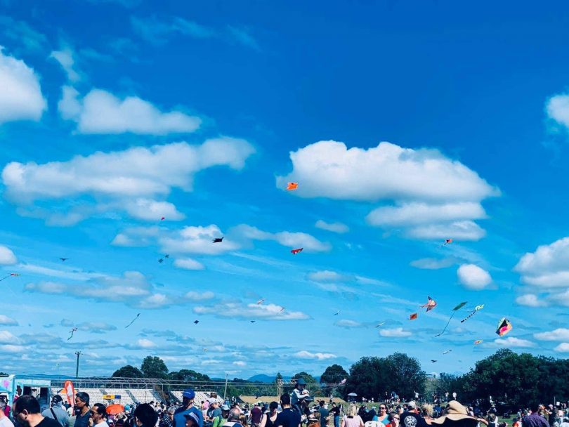 People flying kites