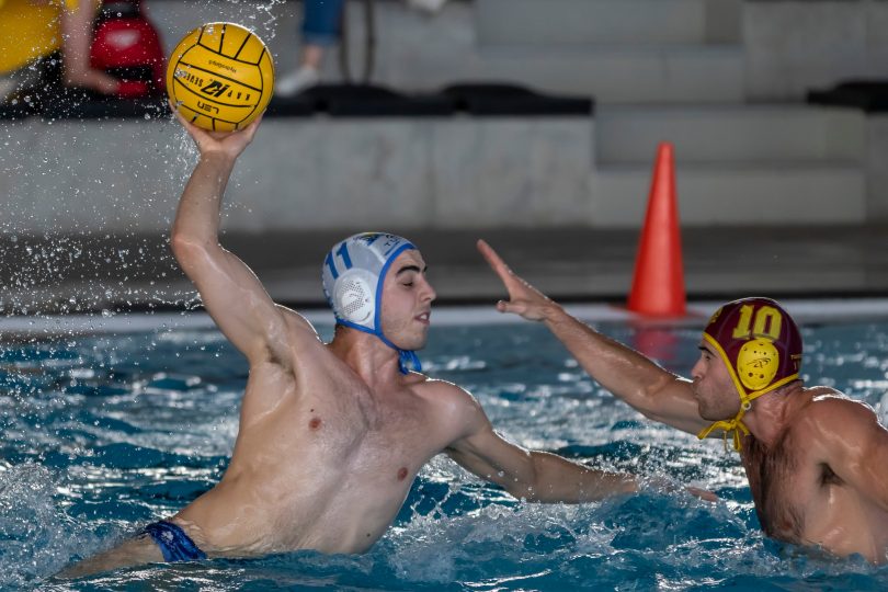 Two people playing Water Polo
