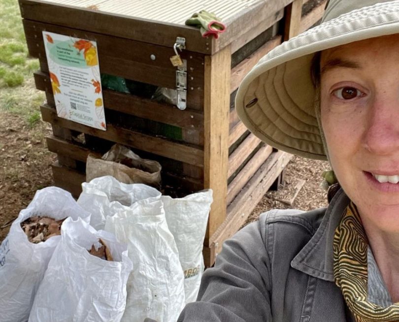 Woman in front of compost