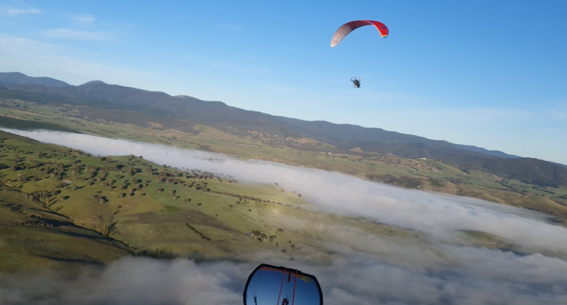 Hang glider over a valley