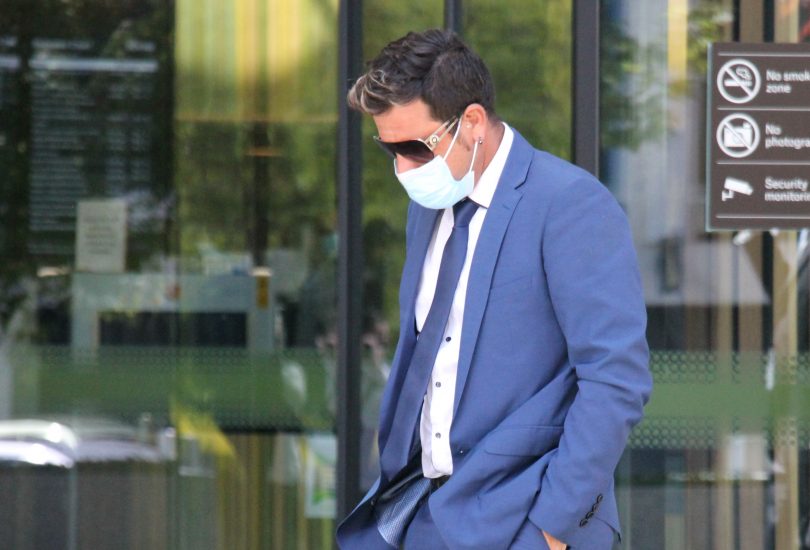 Man leaving court in blue suit
