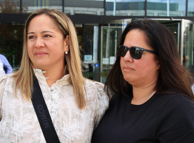 Two women outside court