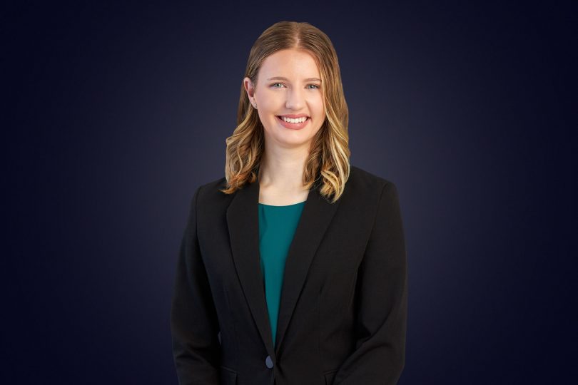 Woman in blazer smiling