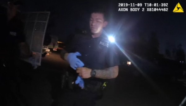police officer at night wearing gloves
