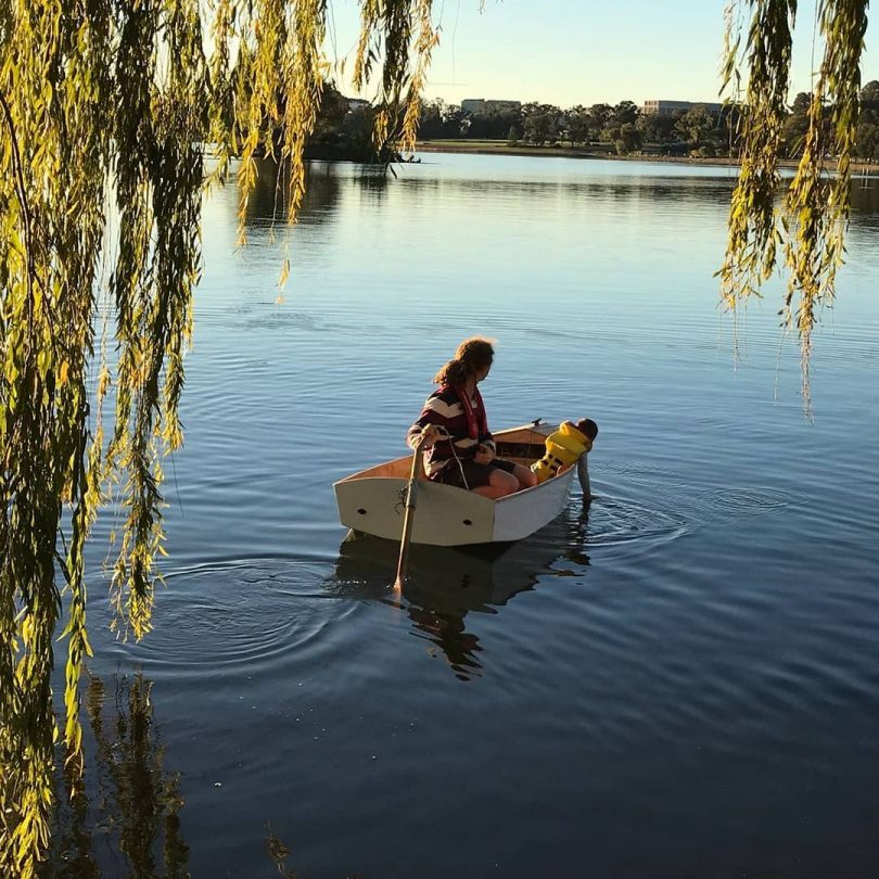 man in boat on water