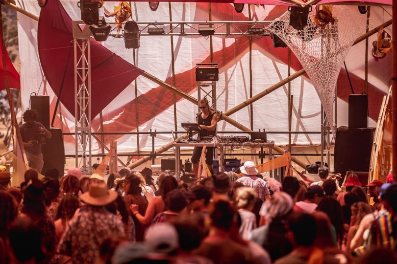 Man on stage at a festival