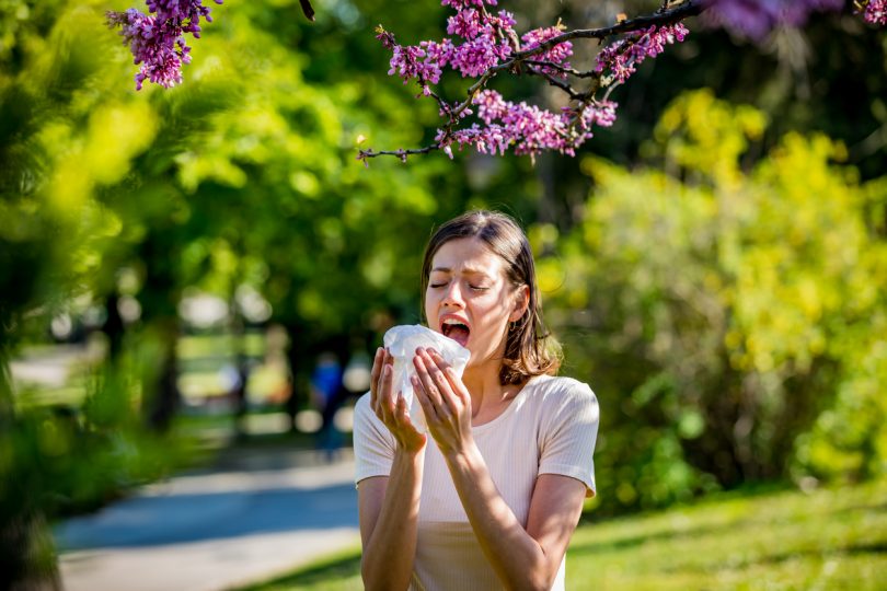 Woman sneezing