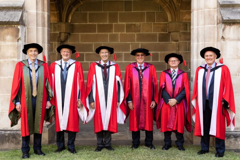 men receiving honorary doctorates