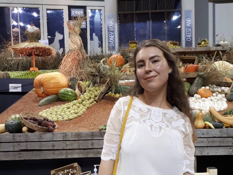 Woman at vegetable display