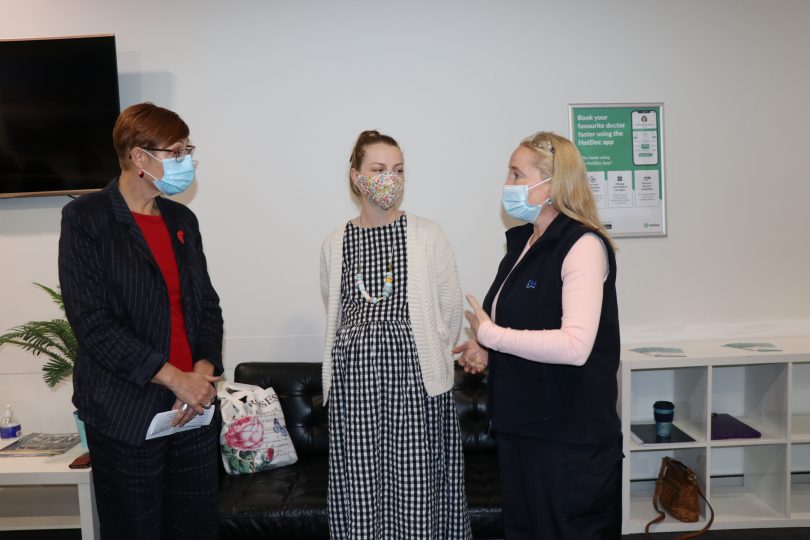 Health Minister Rachel Stephen-Smith speaks with pregnancy care patient Grace Sheehan and continuity midwife Felicity Finn